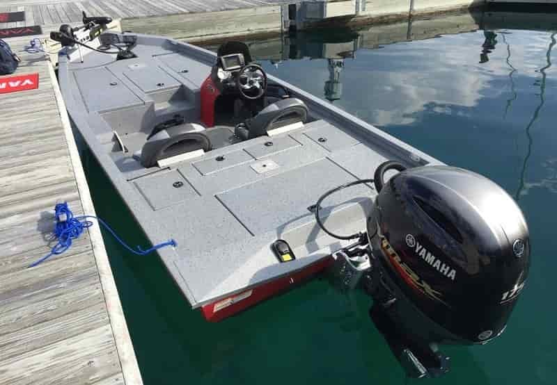aluminum bass boat 175 hp motor at dock