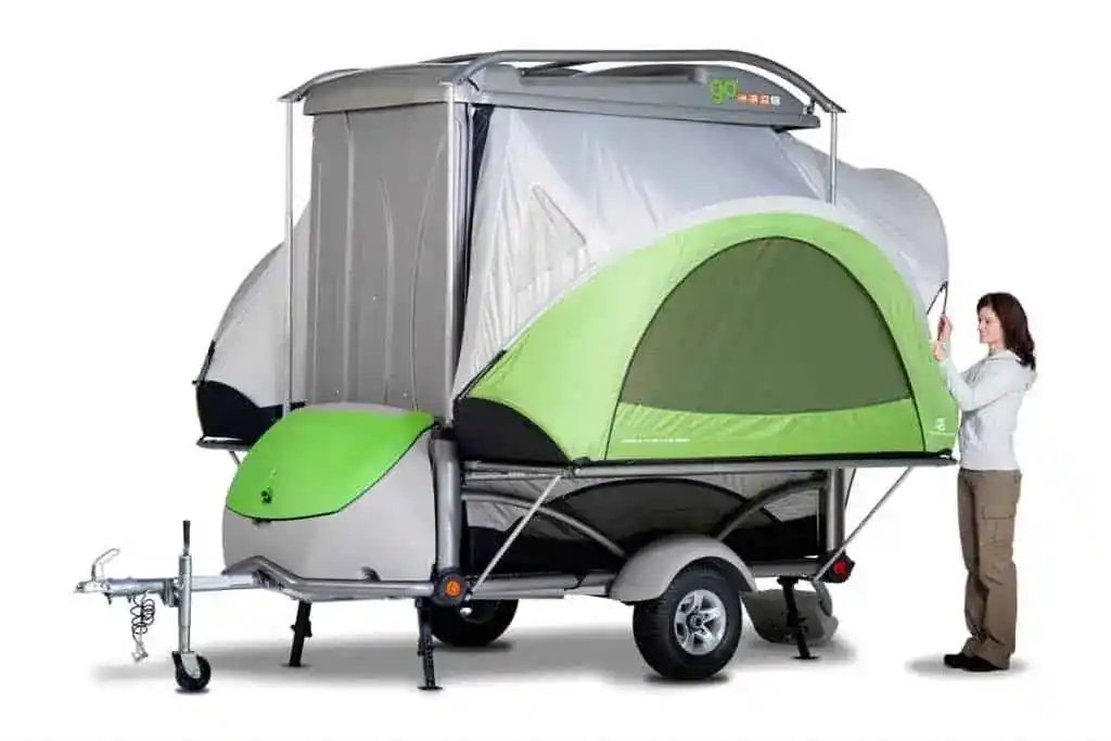 tent trailer with woman erecting tent