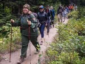 hiking-with-ranger 12 people in line hiking narrow trail