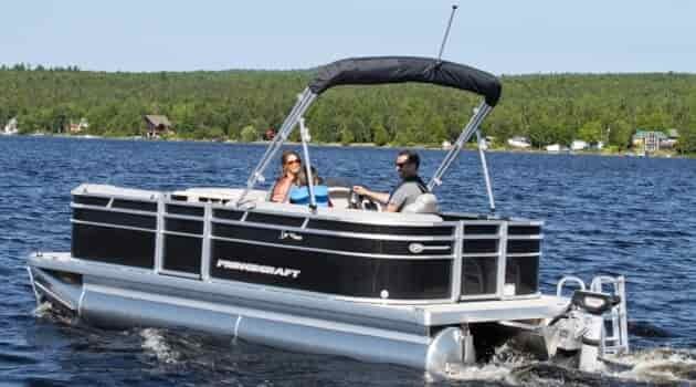 electric pontoon boat 22 foot with family riding in it