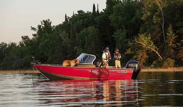 crestliner aluminum 1650-fish-hawk with 2 men fishing and a dog