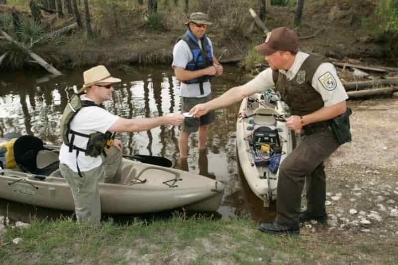 license check for 2 men discussing with ranger Types of License