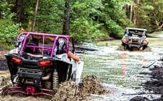 utv riding in mud trail seat high water
