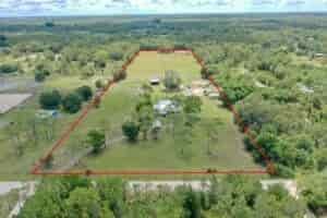 10 acre ranch marked property lines with house barn and open land