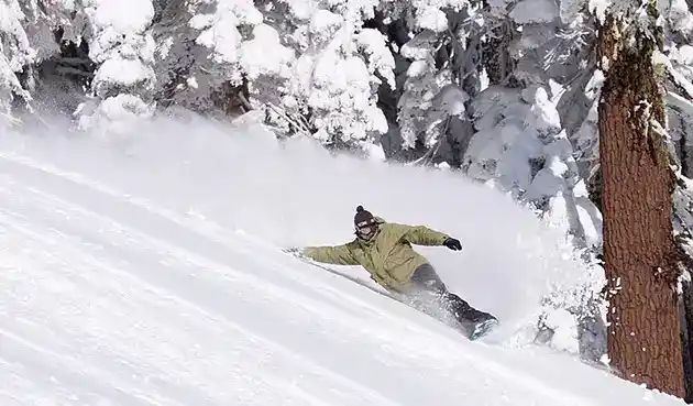 mans snowboarding cutting edge