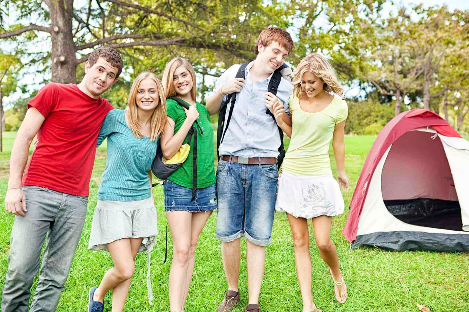 5 college students leaving tents for hiking