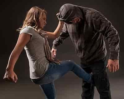women protecting herself from a male attacker
