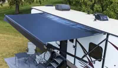 distributor lippert and manufacturer solera solar_awning completely extended out on side of rv