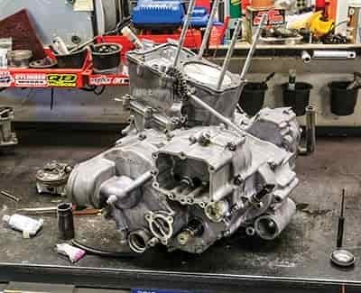 atv engine rebuild on table in parts