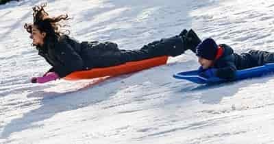brother and sister sledding