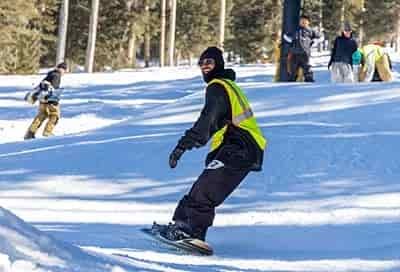 man Snowboarding smiling