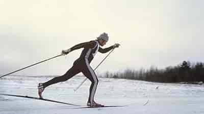 man cross country skiing fast