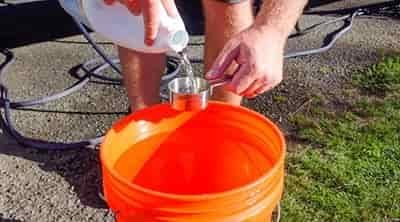 measuring out bleach to clean freshwater tank rv