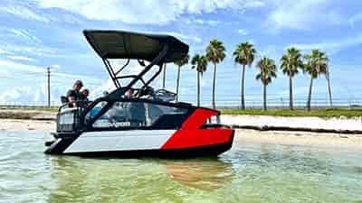 sea doo switch sport pulled up on beach with 3 adults