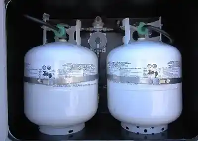 two 20 lb propane tanks in rv storage