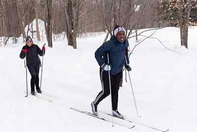 two women cross country skiing