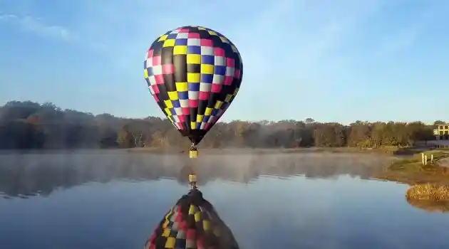 balloon basket just off the water